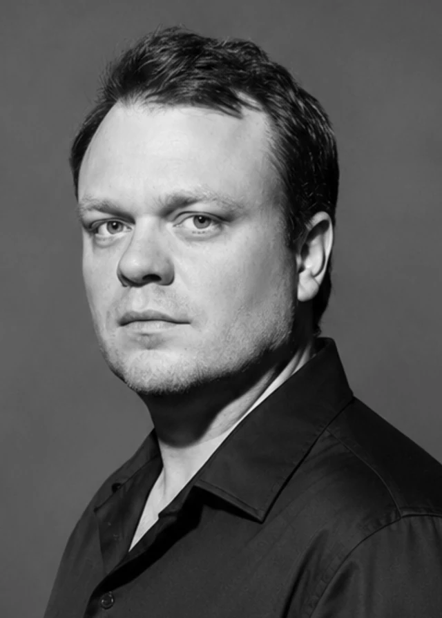 Black-and-white portrait of author Shane Cupp.